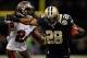 NEW ORLEANS, LA - DECEMBER 16: Mark Ingram #28 of the New Orleans Saints is pushed out of bounds by Mark Barron #24 of the Tampa Bay Buccaneers at the Mercedes-Benz Superdome on December 16, 2012 in New Orleans, Louisiana. The Saints defeated the Buccs 41-0. (Photo by Chris Graythen/Getty Images)