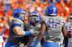 BOISE, ID - OCTOBER 13: Michael Atkinson #99 and Demarcus Lawrence #8 of the Boise State Broncos celebrate after a play against the Fresno State Bulldogs at Bronco Stadium on October 13, 2012 in Boise, Idaho. (Photo by Otto Kitsinger III/Getty Images)