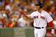BOSTON, MA - JULY 18: Cody Ross #7 of the Boston Red Sox gestures to his teammates in the dugout after hitting his second three run home run of the night in the fourth inning against the Chicago White Sox during the game on July 18, 2012 at Fenway Park in Boston, Massachusetts. (Photo by Jared Wickerham/Getty Images)