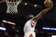 Dec 19, 2012; Houston, TX, USA; Houston Rockets shooting guard James Harden (13) dunks against the Philadelphia 76ers during the fourth quarter at the Toyota Center. The Rockets won 125-103. Mandatory Credit: Thomas Campbell-USA TODAY Sports