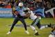 NASHVILLE, TN - DECEMBER 17: Chris Johnson #28 of the Tennessee Titans is tackled by Calvin Pace #97 of the New York Jets at LP Field on December 17, 2012 in Nashville, Tennessee. (Photo by Frederick Breedon/Getty Images)