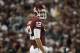 NORMAN, OK - SEPTEMBER 24: Quarterback Landry Jones #12 of the Oklahoma Sooners looks to the sidelines during the first half of the game against the Missouri Tigers on September 24, 2011 at Gaylord Family-Oklahoma Memorial Stadium in Norman, Oklahoma. Oklahoma defeated Missouri 38-28. (Photo by Brett Deering/Getty Images)
