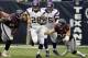 HOUSTON, TX - DECEMBER 23: Adrian Peterson #28 of the Minnesota Vikings rushes past Antonio Smith #94 of the Houston Texans and Connor Barwin #98 at Reliant Stadium on December 23, 2012 in Houston, Texas. (Photo by Bob Levey/Getty Images)