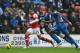 Alex Oxlade-Chmaberlain bursts past his man