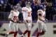 BALTIMORE, MD - DECEMBER 23: Quarterback Eli Manning #10 of the New York Giants walks off the field with teammates Victor Cruz #80 and Henry Hynoski #45 during the fourth quarter of the Giants 33-14 loss to the Baltimore Ravens at M&T Bank Stadium on December 23, 2012 in Baltimore, Maryland. (Photo by Rob Carr/Getty Images)
