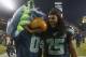 SEATTLE, WA - DECEMBER 09: Cornerback Richard Sherman #25 of the Seattle Seahawks celebrates with Seahawks' mascot Blitz, after the game against the Arizona Cardinals at CenturyLink Field on December 9, 2012 in Seattle, Washington. The Seahawks defeated the Cardinals 58-0. (Photo by Otto Greule Jr/Getty Images)