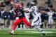Dec. 15, 2012; Albuquerque, NM, USA; Arizona Wildcats running back Ka'Deem Carey (25) runs the ball against the Nevada Wolf Pack in the first half of the 2012 New Mexico Bowl at University Stadium. Mandatory Credit: Mark J. Rebilas-USA TODAY Sports