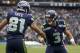 SEATTLE, WA - NOVEMBER 04: Golden Tate #81, of the Seattle Seahawks celebrates a touchdown with teammate Russell Wilson #3 during a game against the Minnesota Vikings at CenturyLink Field on November 4, 2012 in Seattle, Washington. (Photo by Stephen Brashear/Getty Images)