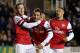 READING, ENGLAND - DECEMBER 17: Santi Cazorla of Arsenal (C) celebrates after scoring his third and Arsenal's fourth with Jack Wilshere (L) and Alex Oxlade Chamberlain during the Barclays Premier League match between Reading and Arsenal at Madejski Stadium on December 17, 2012 in Reading, England. (Photo by Scott Heavey/Getty Images)