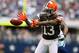 Nov 18, 2012; Arlington, TX, USA; Cleveland Browns receiver Josh Gordon (13) can not make a reception against Dallas Cowboys cornerback Orlando Scandrick (32) in the second quarter at Cowboys Stadium. Mandatory Credit: Matthew Emmons-USA TODAY Sports