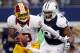 ARLINGTON, TX - NOVEMBER 22: Robert Griffin III #10 of the Washington Redskins scrambles with the ball before being sacked by Jason Hatcher #97 of the Dallas Cowboys on Thanksgiving Day at Cowboys Stadium on November 22, 2012 in Arlington, Texas. (Photo by Tom Pennington/Getty Images)