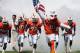 Sept 15 2012; Miami Gardens, FL, USA; Miami Hurricanes mascot Sebastian the Ibis, players and head coach Al Golden enter the field before a game against the Bethune Cookman Wildcats at Sun Life Stadium. Mandatory Credit: Robert Mayer-USA TODAY Sports