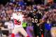 December 23, 2012; Baltimore, MD,USA; New York Giants wide receiver Victor Cruz (80) reaches for a pass while being defended by Baltimore Ravens safety Ed Reed (20) at M&T Bank Stadium. Mandatory Credit: Evan Habeeb-USA TODAY Sports