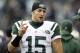 Nov 11, 2012; Seattle, WA, USA; New York Jets quarterback Tim Tebow (15) speaks with a coach on the sideline during the third quarter against the Seattle Seahawks at CenturyLink Field. Mandatory Credit: Joe Nicholson-USA TODAY Sports