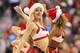 Dec 21, 2012; Toronto, ON, Canada; A member of the Toronto Raptors dance team performs wearing a Santa Claus outfit during a break in the action against the Orlando Magic at the Air Canada Centre. The Raptors beat the Magic 93-90. Mandatory Credit: Tom Szczerbowski-USA TODAY Sports