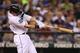 SEATTLE, WA - AUGUST 18: Justin Smoak #17 of the Seattle Mariners hits a home run in the seventh inning to tie the game against the Minnesota Twins at Safeco Field on August 18, 2012 in Seattle, Washington. (Photo by Otto Greule Jr/Getty Images)