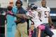 Oct 7, 2012; Jacksonville FL, USA; Chicago Bears head coach Lovie Smith (in back) watches as wide receiver Devin Hester (23) makes a diving catch in the fourth quarter of their game against the Jacksonville Jaguars at EverBank Field. The Bears won 41-3. Mandatory Credit: Phil Sears-USA TODAY Sports