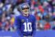 EAST RUTHERFORD, NJ - DECEMBER 30: Eli Manning #10 of the New York Giants looks on between plays in the fourth quarter against the Philadelphia Eagles at MetLife Stadium on December 30, 2012 in East Rutherford, New Jersey. The New York Giants defeated the Philadelphia Eagles 42-7. (Photo by Elsa/Getty Images)