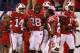 INDIANAPOLIS, IN - DECEMBER 01: Marcus Cromartie #14 of the Wisconsin Badgers celebrates a first quarter touchdown after intercepting Taylor Martinez #3 of the Nebraska Cornhuskers during the first quarter of the Big Ten Championship at Lucas Oil Stadium on December 1, 2012 in Indianapolis, Indiana. (Photo by Leon Halip/Getty Images)