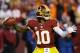 LANDOVER, MD - DECEMBER 30: Robert Griffin III #10 of the Washington Redskins looks ot pass against the Dallas Cowboys in the second quarter at FedExField on December 30, 2012 in Landover, Maryland. (Photo by Rob Carr/Getty Images)