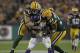 GREEN BAY, WI - NOVEMBER 14: Clay Matthews #52 and Charles Woodson #21 of the Green Bay Packers stop Adrian Peterson #28 of the Minnesota Vikings at Lambeau Field on November 14, 2011 in Green Bay, Wisconsin. The Packers defeated the Vikings 45-7. (Photo by Jonathan Daniel/Getty Images)