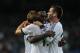 MADRID, SPAIN - NOVEMBER 3: Luka Modric (L) of Real Madrid CF celebrates scoring their fourth goal with teammates Essien (2ndL) and Nacho Fernandez (R) during the La Liga match between Real Madrid CF and Real Zaragoza at Estadio Santiago Bernabeu on November 3, 2012 in Madrid, Spain. (Photo by Gonzalo Arroyo Moreno/Getty Images)