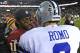 Dec 30, 2012; Landover, MD, USA; Washington Redskins quarterback Robert Griffin III (10) talks with Dallas Cowboys quarterback Tony Romo (9) after the game at FedEX Field. The Redskins won 28 - 18. Mandatory Credit: Brad Mills-USA Today Sports