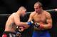 Dec 29, 2012; Las Vegas, NV, USA; Cain Velasquez (left) and Junior Dos Santos (right) during UFC 155 at the MGM Grand Garden Arena. Mandatory Credit: Gary A. Vasquez-USA TODAY Sports