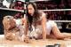 Dolph Ziggler and AJ Lee get slimed with a substance resembling diarrhea at the close of the New Year's Eve edition of Raw. (WWE.com photo)
