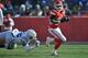 KANSAS CITY, MO - DECEMBER 23: Running back Jamaal Charles #25 of the Kansas City Chiefs rushes past defensive end Dontari Poe #92 of the Indianapolis Colts during the first half on December 23, 2012 at Arrowhead Stadium in Kansas City, Missouri. (Photo by Peter Aiken/Getty Images)