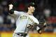 NEW YORK, NY - SEPTEMBER 26: Jeff Karstens #27 of the Pittsburgh Pirates pitches against the New York Mets at Citi Field on September 26, 2012 in the Flushing neighborhood of the Queens borough of New York City. (Photo by Alex Trautwig/Getty Images)