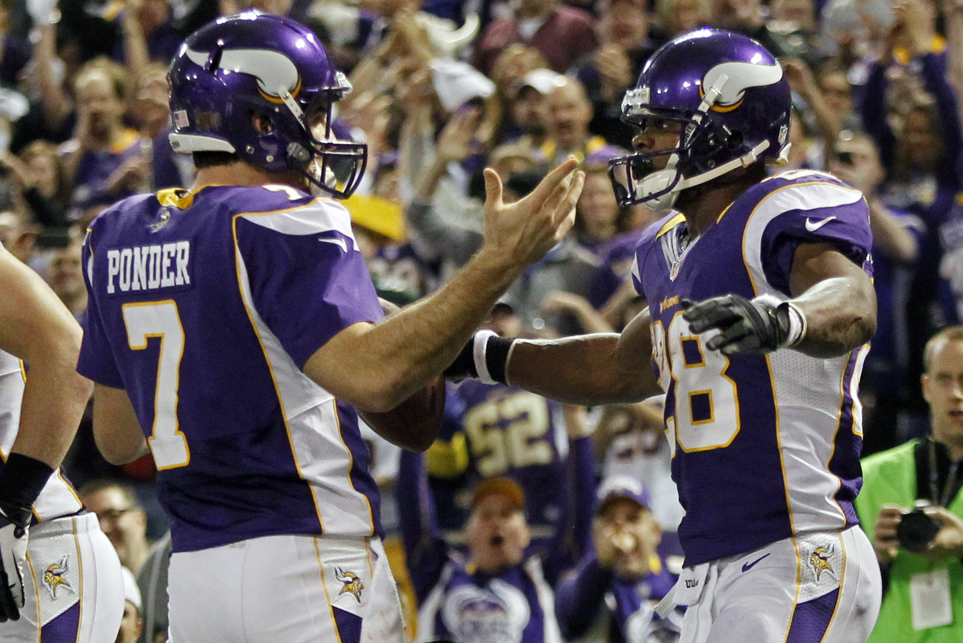 Joe Webb of the Minnesota Vikings celebrates after scoring a