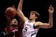 LAWRENCE, KS - JANUARY 06: Khalif Wyatt #1 of the Temple Owls shoots as Jeff Withey #5 of the Kansas Jayhawks defends during the game at Allen Fieldhouse on January 6, 2013 in Lawrence, Kansas. (Photo by Jamie Squire/Getty Images)