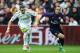 SWANSEA, WALES - JANUARY 06: Theo Walcott of Arsenal chases the ball with Chico Flores of Swansea City during the FA Cup with Budweiser Third Round match between Swansea City and Arsenal at Liberty Stadium on January 6, 2013 in Swansea, Wales. (Photo by Ben Hoskins/Getty Images)