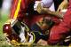 LANDOVER, MD - JANUARY 06: Robert Griffin III #10 of the Washington Redskins is injured on a bad snap in the fourth quarter against the Seattle Seahawks during the NFC Wild Card Playoff Game at FedExField on January 6, 2013 in Landover, Maryland. (Photo by Al Bello/Getty Images)
