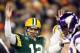 GREEN BAY, WI - JANUARY 05: Quarterback Aaron Rodgers #12 of the Green Bay Packers signals for a touchdown on a run by teamamte running back DuJuan Harris #26 in the first quarter against the Minnesota Vikings during the NFC Wild Card Playoff game at Lambeau Field on January 5, 2013 in Green Bay, Wisconsin. Harris was awarded a touchdown after the play was reviewed. (Photo by Andy Lyons/Getty Images)