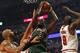 CHICAGO, IL - NOVEMBER 26: Samuel Dalembert #21 of the Milwaukee Bucks shoots between Carlos Boozer #5 and Loul Deng #9 of the Chicago Bulls at the United Center on November 26, 2012 in Chicago, Illinois. The Bucks defeated the Bulls 93-92. NOTE TO USER: User expressly acknowledges and agrees that, by downloading and or using this photograph, User is consenting to the terms and conditions of the Getty Images License Agreement. (Photo by Jonathan Daniel/Getty Images)