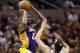 Jan 9, 2013; San Antonio, TX, USA; Los Angeles Lakers forward Earl Clark (6) takes a shot over San Antonio Spurs guard Manu Ginobili (20) during the second half at the AT&T Center. The Spurs won 108-105. Mandatory Credit: Soobum Im-USA TODAY Sports