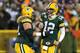 GREEN BAY, WI - JANUARY 05: (R) Quarterback Aaron Rodgers #12 and guard Josh Sitton #71 of the Green Bay Packers celebrate after fullback John Kuhn #30 scorers on a nine-yard catch and run in the third quarter against the Minnesota Vikings during the NFC Wild Card Playoff game at Lambeau Field on January 5, 2013 in Green Bay, Wisconsin. (Photo by Andy Lyons/Getty Images)