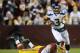 LANDOVER, MD - JANUARY 06: Russell Wilson #3 of the Seattle Seahawks runs the ball during their NFC Wild Card Playoff Game against the Washington Redskins at FedExField on January 6, 2013 in Landover, Maryland. (Photo by Patrick McDermott/Getty Images)