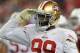 GLENDALE, AZ - OCTOBER 29: Aldon Smith #99 of the San Francisco 49ers salutes the crowd after getting a sack against the Arizona Cardinals at University of Phoenix Stadium on October 29, 2012 in Glendale, Arizona. 49rs won 24-3. (Photo by Norm Hall/Getty Images)