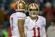 Dec 23, 2012; Seattle, WA, USA; San Francisco 49ers quarterbacks Alex Smith (11) and Colin Kaepernick (7) react against the Seattle Seahawks at CenturyLink Field. Mandatory Credit: Kirby Lee/Image of Sport-USA TODAY Sports