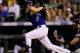 DENVER, CO - AUGUST 16: Michael Cuddyer #3 of the Colorado Rockies hits two-run, game-tying home run over the left field wall during the sixth inning against the Miami Marlins at Coors Field on August 16, 2012 in Denver, Colorado. (Photo by Justin Edmonds/Getty Images)