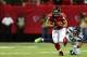 ATLANTA, GA - JANUARY 13: Michael Turner #33 of the Atlanta Falcons tries to avoid the tackle of K.J. Wright #50 of the Seattle Seahawks in the first quarter of the NFC Divisional Playoff Game at Georgia Dome on January 13, 2013 in Atlanta, Georgia. (Photo by Mike Ehrmann/Getty Images)