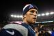 FOXBORO, MA - JANUARY 13: Tom Brady #12 of the New England Patriots walks on the field after defeating the Houston Texans by a score of 41-28 to win the 2013 AFC Divisional Playoffs game at Gillette Stadium on January 13, 2013 in Foxboro, Massachusetts. (Photo by Elsa/Getty Images)