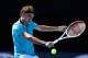 Roger Federer of Switzerland, hitting a backhand in his straight sets victory over Benoit Paire of France