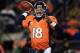 DENVER, CO - JANUARY 12: Peyton Manning #18 of the Denver Broncos throws an 17-yard touchdown pass to Demaryius Thomas #88 in the third quarter against the Baltimore Ravens during the AFC Divisional Playoff Game at Sports Authority Field at Mile High on January 12, 2013 in Denver, Colorado. (Photo by Doug Pensinger/Getty Images)