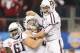 Luke Joeckel (center) lifting up quarterback.