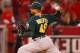 ANAHEIM, CA - MAY 23: Michael Wuertz #48 of the Oakland Athletics pitches in the eighth inning during the game against the Los Angeles Angels of Anaheim at Angel Stadium on May 23, 2011 in Anaheim, California. (Photo by Joe Scarnici/Getty Images)