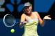 MELBOURNE, AUSTRALIA - JANUARY 14: Maria Sharapova of Russia plays a forehand in her first round match against Olga Puchkova of Russia during day one of the 2013 Australian Open at Melbourne Park on January 14, 2013 in Melbourne, Australia. (Photo by Scott Barbour/Getty Images)